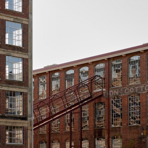 Find your perfect fit at 2005 at Revolution Mill Apartments a building with a staircase